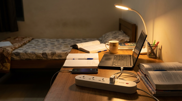 AZIOT smart extension board on a student hostel study desk